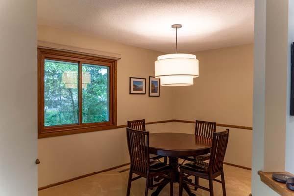 9826 Brighton Ln, Eden Prairie, MN 55347 - dining room with baseboards