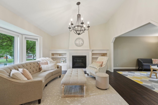 669 Lake Pine Dr, Shoreview, MN 55126 - living room with a chandelier, wood finished floors, a tile fireplace, and baseboards