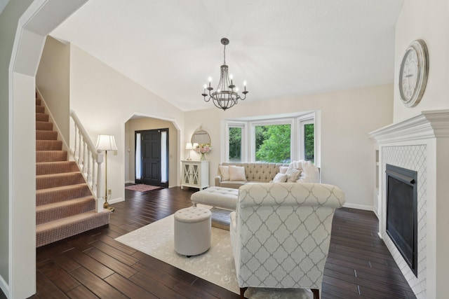669 Lake Pine Dr, Shoreview, MN 55126 - living room with a chandelier, dark wood-style floors, stairway, a fireplace, and baseboards