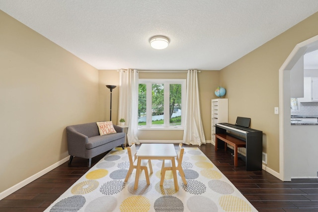 669 Lake Pine Dr, Shoreview, MN 55126 - living room with dark wood finished floors, baseboards, and a textured ceiling