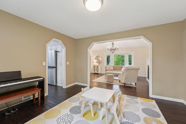 669 Lake Pine Dr, Shoreview, MN 55126 - living area with arched walkways, hardwood / wood-style floors, a chandelier, and baseboards