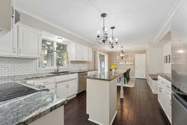 669 Lake Pine Dr, Shoreview, MN 55126 - kitchen with a sink, appliances with stainless steel finishes, a chandelier, a kitchen island, and dark wood finished floors