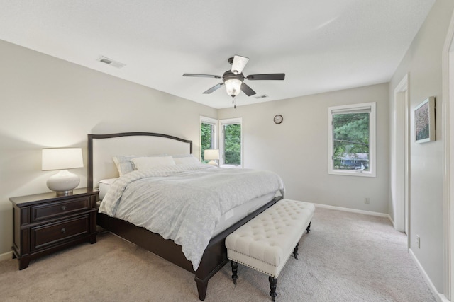 669 Lake Pine Dr, Shoreview, MN 55126 - bedroom featuring light carpet, baseboards, and ceiling fan
