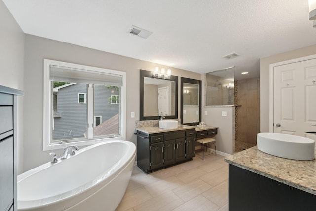 669 Lake Pine Dr, Shoreview, MN 55126 - bathroom featuring a walk in shower, two vanities, a freestanding bath, tile patterned floors, and baseboards