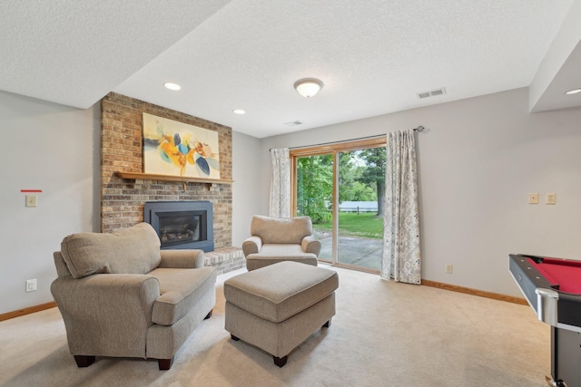 669 Lake Pine Dr, Shoreview, MN 55126 - living area with a textured ceiling, light carpet, baseboards, a brick fireplace, and recessed lighting
