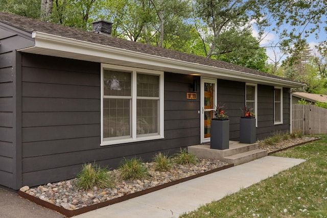 18201 Kathleene Dr, Minnetonka, MN 55345 - doorway to property with a chimney