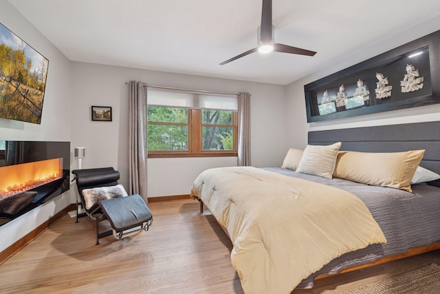 18201 Kathleene Dr, Minnetonka, MN 55345 - bedroom with wood finished floors, baseboards, and ceiling fan