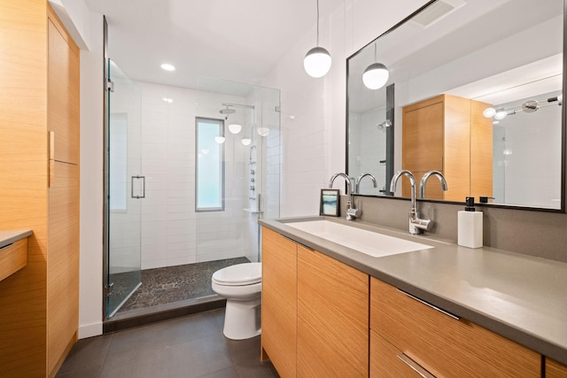 18201 Kathleene Dr, Minnetonka, MN 55345 - full bathroom featuring vanity, toilet, a shower stall, and tile patterned floors