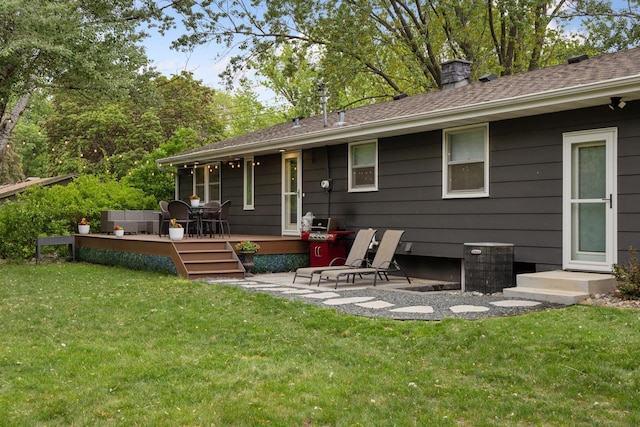 18201 Kathleene Dr, Minnetonka, MN 55345 - rear view of house with a wooden deck, a chimney, a lawn, and roof with shingles
