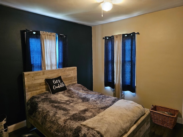 205 2nd Ave W, Lamberton, MN 56152 - bedroom featuring baseboards, wood finished floors, and ceiling fan