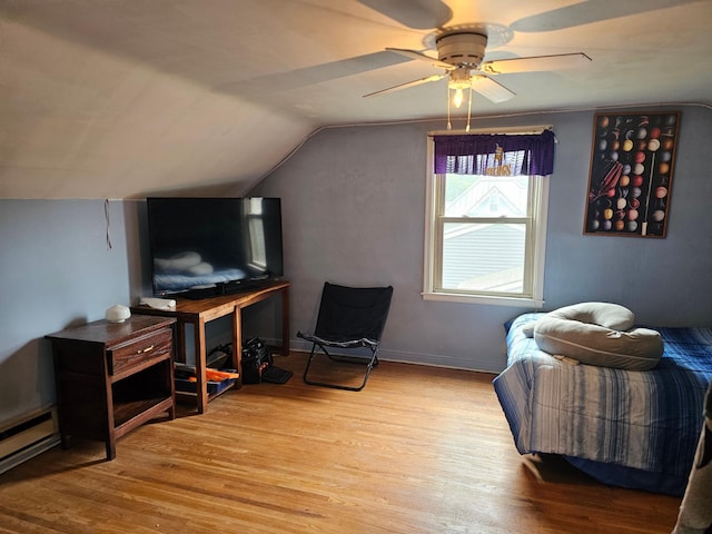 205 2nd Ave W, Lamberton, MN 56152 - additional living space featuring wood finished floors, ceiling fan, lofted ceiling, and a baseboard heating unit