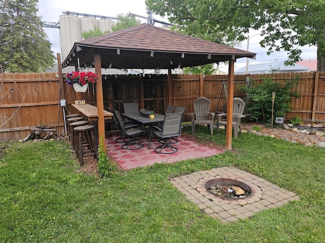 205 2nd Ave W, Lamberton, MN 56152 - view of yard featuring an outdoor fire pit, a gazebo, and a patio area