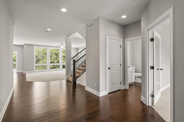 1206 Rosemary Ln, Chaska, MN 55318 - corridor featuring stairs, baseboards, dark wood-style floors, and recessed lighting