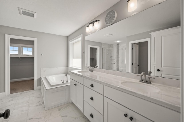 1206 Rosemary Ln, Chaska, MN 55318 - full bathroom featuring marble look tiles, a shower stall, a bath, double vanity, and baseboards