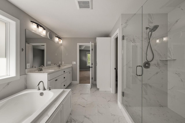 1206 Rosemary Ln, Chaska, MN 55318 - bathroom featuring a marble finish shower, marble finish floors, double vanity, a bath, and baseboards
