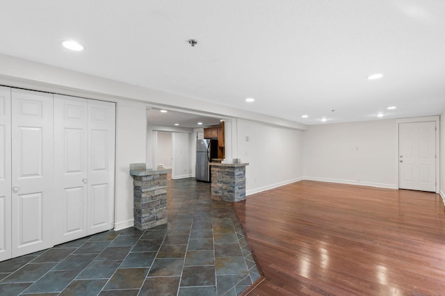 1930 Aldrich Ave S Unit C001, Minneapolis, MN 55403 - unfurnished living room featuring recessed lighting, baseboards, and dark wood-type flooring