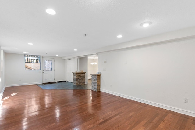 1930 Aldrich Ave S Unit C001, Minneapolis, MN 55403 - unfurnished living room with baseboards, wood finished floors, and recessed lighting