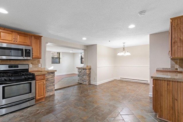 1930 Aldrich Ave S Unit C001, Minneapolis, MN 55403 - kitchen with appliances with stainless steel finishes, a baseboard heating unit, backsplash, baseboards, and brown cabinets