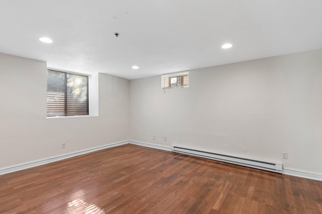 1930 Aldrich Ave S Unit C001, Minneapolis, MN 55403 - spare room featuring a baseboard heating unit, baseboards, wood finished floors, recessed lighting, and fire sprinkler in ceiling