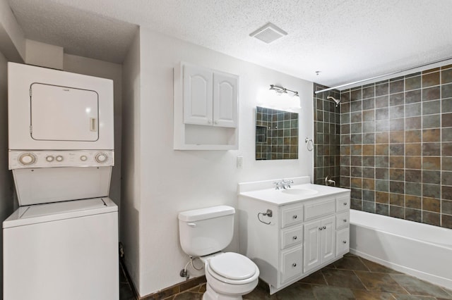 1930 Aldrich Ave S Unit C001, Minneapolis, MN 55403 - full bath with stacked washer and clothes dryer, vanity, a textured ceiling, toilet, and shower / bathtub combination