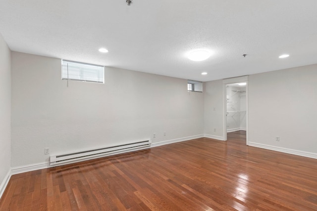 1930 Aldrich Ave S Unit C001, Minneapolis, MN 55403 - below grade area with a baseboard heating unit, wood finished floors, baseboards, and recessed lighting