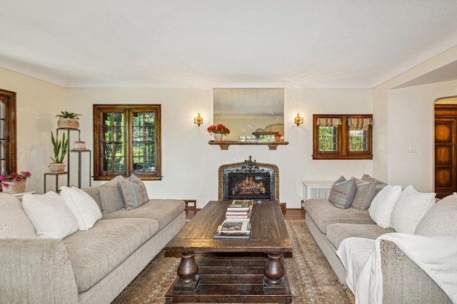 5319 Upton Ave S, Minneapolis, MN 55410 - living room featuring a warm lit fireplace and arched walkways