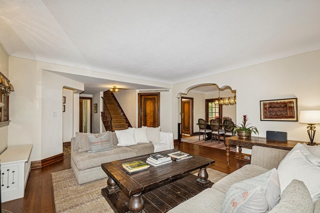 5319 Upton Ave S, Minneapolis, MN 55410 - living room featuring stairway, arched walkways, and wood-type flooring