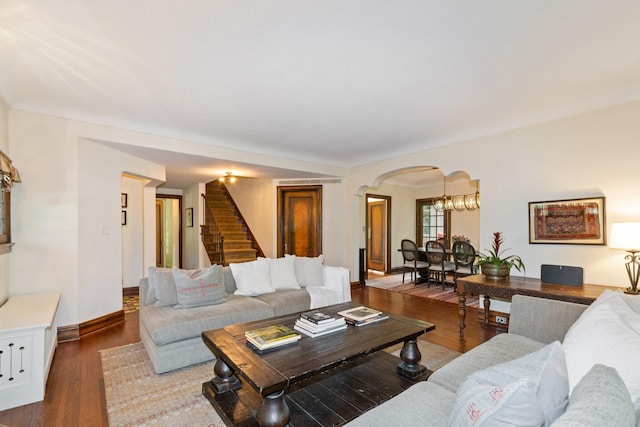 5319 Upton Ave S, Minneapolis, MN 55410 - living room featuring arched walkways, stairway, and wood finished floors