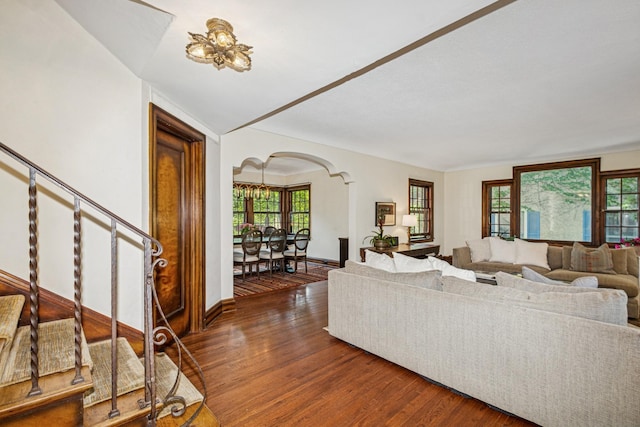 5319 Upton Ave S, Minneapolis, MN 55410 - living area with arched walkways, plenty of natural light, stairs, and wood finished floors