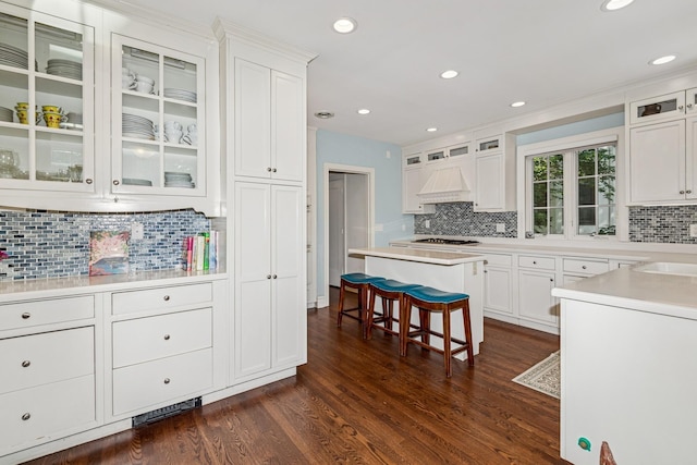 5319 Upton Ave S, Minneapolis, MN 55410 - kitchen featuring stainless steel gas stovetop, tasteful backsplash, white cabinets, dark wood-style floors, and recessed lighting