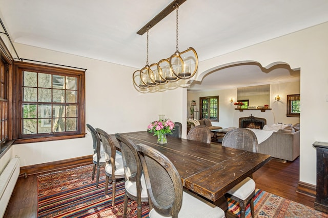 5319 Upton Ave S, Minneapolis, MN 55410 - dining space with a warm lit fireplace, wood finished floors, and a chandelier