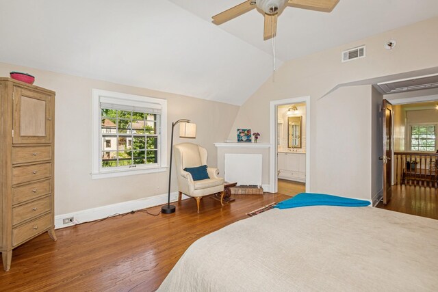 5319 Upton Ave S, Minneapolis, MN 55410 - bedroom featuring wood finished floors, vaulted ceiling, attic access, ceiling fan, and ensuite bath
