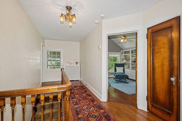 5319 Upton Ave S, Minneapolis, MN 55410 - hallway with lofted ceiling, wood finished floors, healthy amount of natural light, radiator, and a chandelier