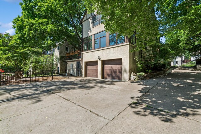 5319 Upton Ave S, Minneapolis, MN 55410 - view of property exterior with stucco siding, driveway, and an attached garage