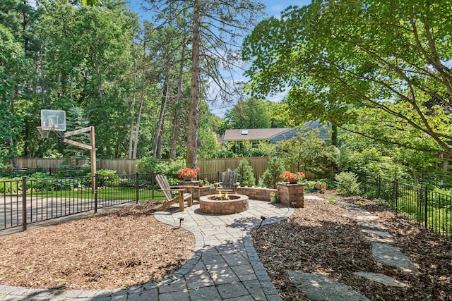 5319 Upton Ave S, Minneapolis, MN 55410 - fenced backyard with a fire pit and a patio