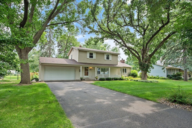 2168 Southwood Dr, White Bear Lake, MN 55110 - traditional-style home with driveway, an attached garage, a front lawn, a chimney, and board and batten siding
