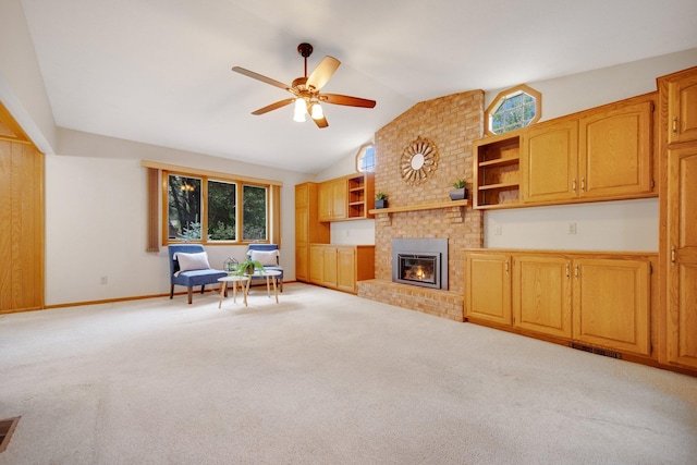 2168 Southwood Dr, White Bear Lake, MN 55110 - living area with a ceiling fan, a brick fireplace, light carpet, and high vaulted ceiling