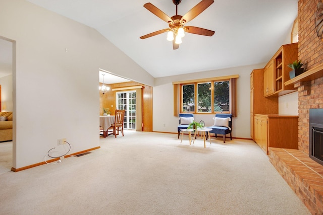 2168 Southwood Dr, White Bear Lake, MN 55110 - living area with a fireplace, vaulted ceiling, light colored carpet, and a ceiling fan