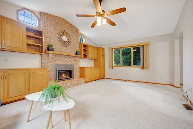 2168 Southwood Dr, White Bear Lake, MN 55110 - unfurnished living room featuring vaulted ceiling, light carpet, a ceiling fan, and a fireplace