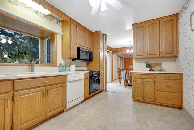 2168 Southwood Dr, White Bear Lake, MN 55110 - kitchen with dishwasher, black microwave, wallpapered walls, ceiling fan, and range