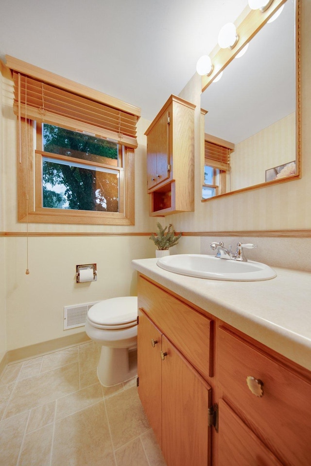 2168 Southwood Dr, White Bear Lake, MN 55110 - bathroom with wallpapered walls and vanity