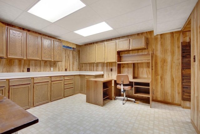 2168 Southwood Dr, White Bear Lake, MN 55110 - unfurnished office with built in study area, wooden walls, light floors, and a paneled ceiling