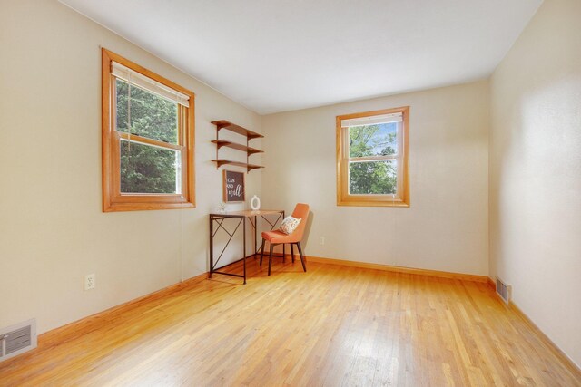 2168 Southwood Dr, White Bear Lake, MN 55110 - empty room with healthy amount of natural light and wood finished floors