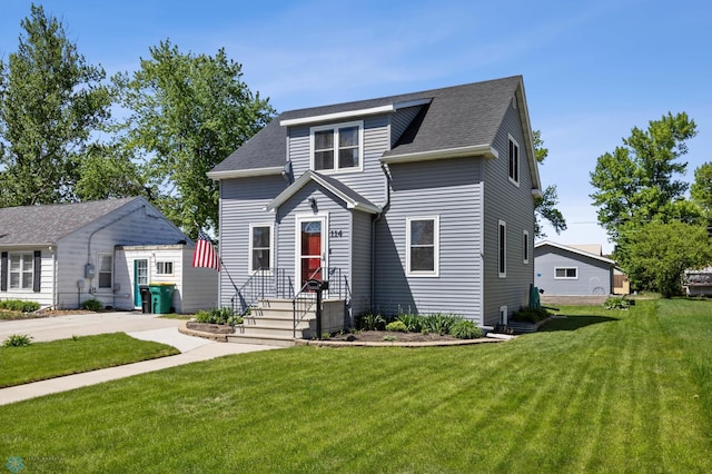 114 2nd Ave E, West Fargo, ND 58078 - view of front facade featuring a front yard and roof with shingles