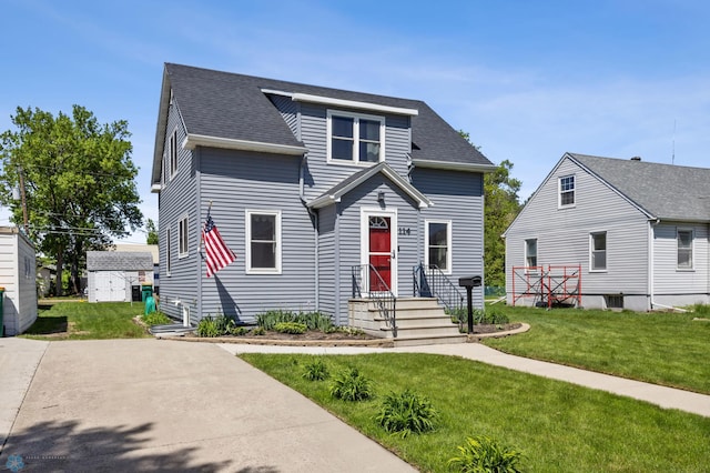 114 2nd Ave E, West Fargo, ND 58078 - view of front of house with a front yard and roof with shingles