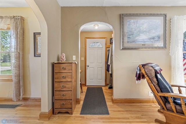 114 2nd Ave E, West Fargo, ND 58078 - entrance foyer with arched walkways, light wood-style floors, and baseboards