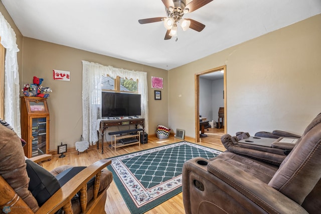 114 2nd Ave E, West Fargo, ND 58078 - living area with a ceiling fan, wood finished floors, and baseboards