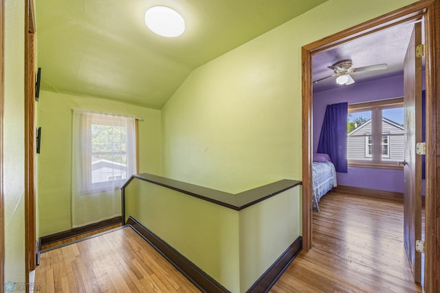 114 2nd Ave E, West Fargo, ND 58078 - corridor with lofted ceiling, hardwood / wood-style floors, an upstairs landing, and baseboards