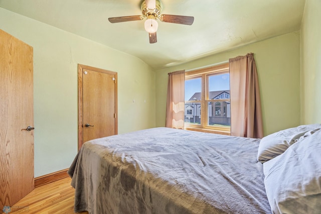 114 2nd Ave E, West Fargo, ND 58078 - bedroom featuring light wood finished floors, baseboards, a ceiling fan, and vaulted ceiling