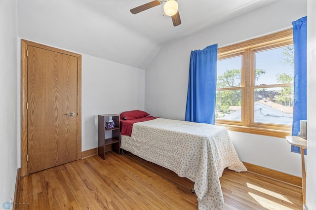114 2nd Ave E, West Fargo, ND 58078 - bedroom with lofted ceiling, light wood-style floors, baseboards, and a ceiling fan